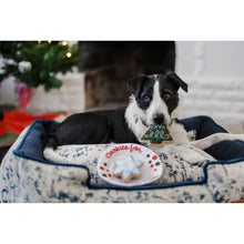 Load image into Gallery viewer, Dog playing with P.L.A.Y. Christmas Eve Cookies Dog Toy, perfect for holiday fun.
