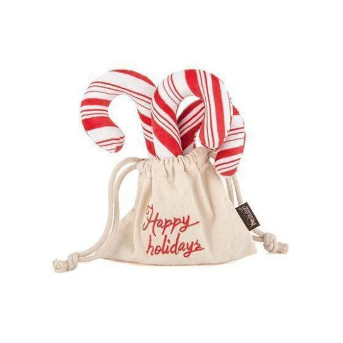 Christmas Candy Canes Plush Toy for dogs, soft with a built-in squeaker, perfect for holiday play.