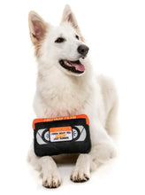 Load image into Gallery viewer, Dog playing with Fuzzyard Horror Movie VHS toy featuring squeaker and crinkle paper, designed for fun and spooky playtime.
