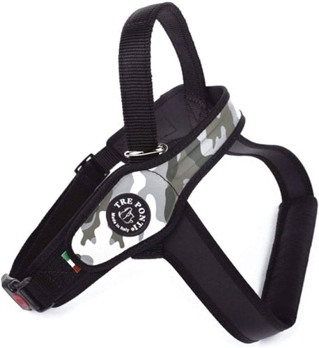 A brown dog walking through shallow water while wearing the Tre Ponti Primo Plus American camouflage harness with handle.