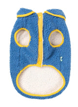 Load image into Gallery viewer, Underside view of the FuzzYard Hana Dog Jacket in blue, showing soft sherpa lining, snap-button closure, and yellow trim.
