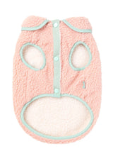 Load image into Gallery viewer, Underside view of the FuzzYard Hana Dog Jacket in pink, showing soft sherpa lining, snap-button closure, and yellow trim.
