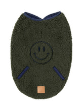 Load image into Gallery viewer, Dark moss green sherpa dog jacket with embroidered smiley face and navy trim, displayed flat on a white background.

