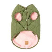 Load image into Gallery viewer, Underside view of the FuzzYard Nara Reversible Dog Jacket showing the olive green quilted side with pink sherpa lining and snap-button closure.
